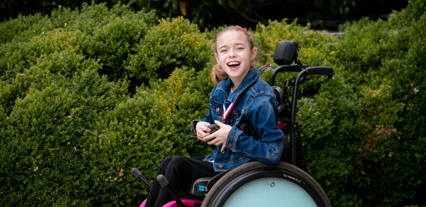 Madison Rogers, a young girl using a motorized wheelchair